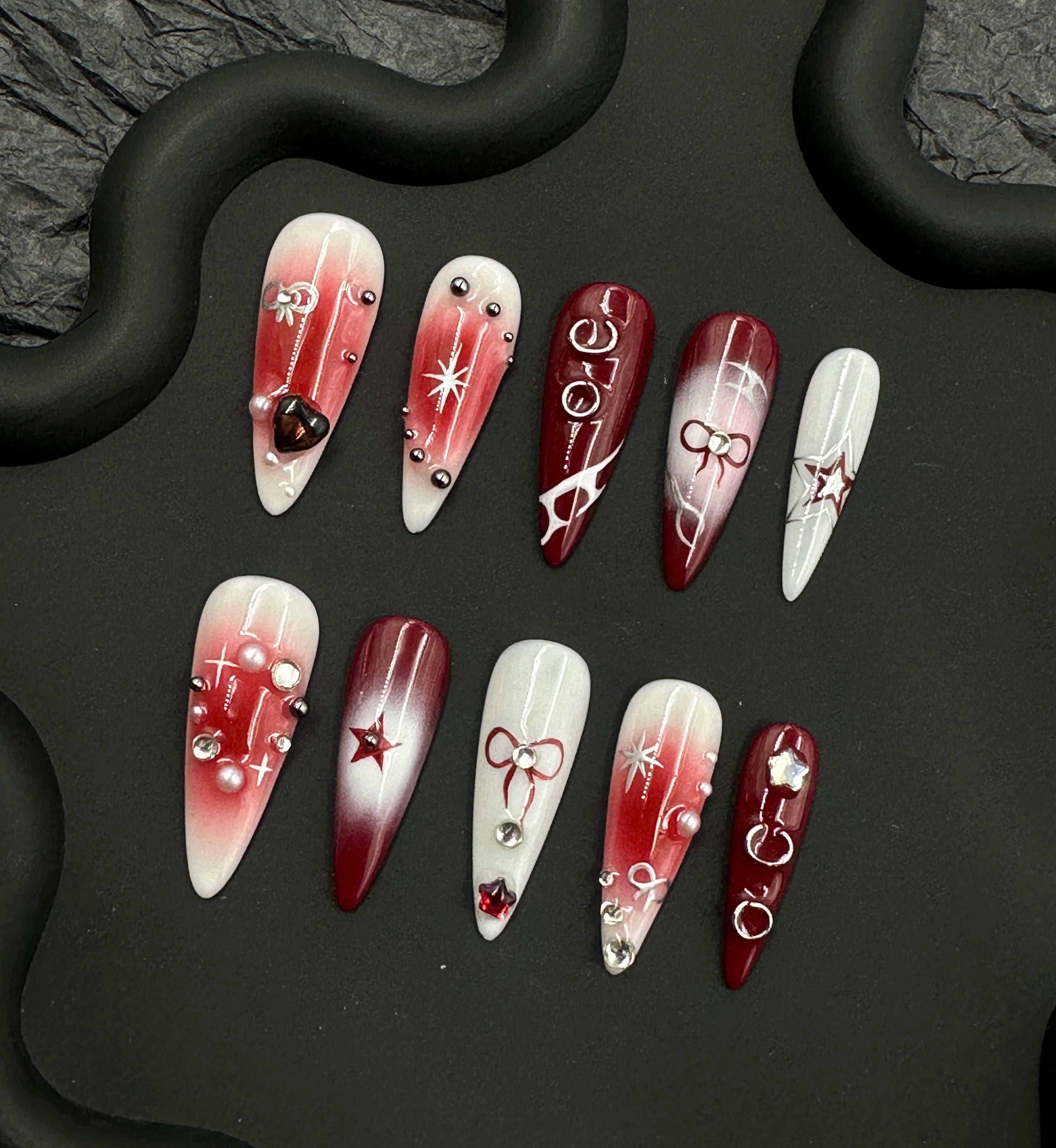 Red hand painted manicure with theme