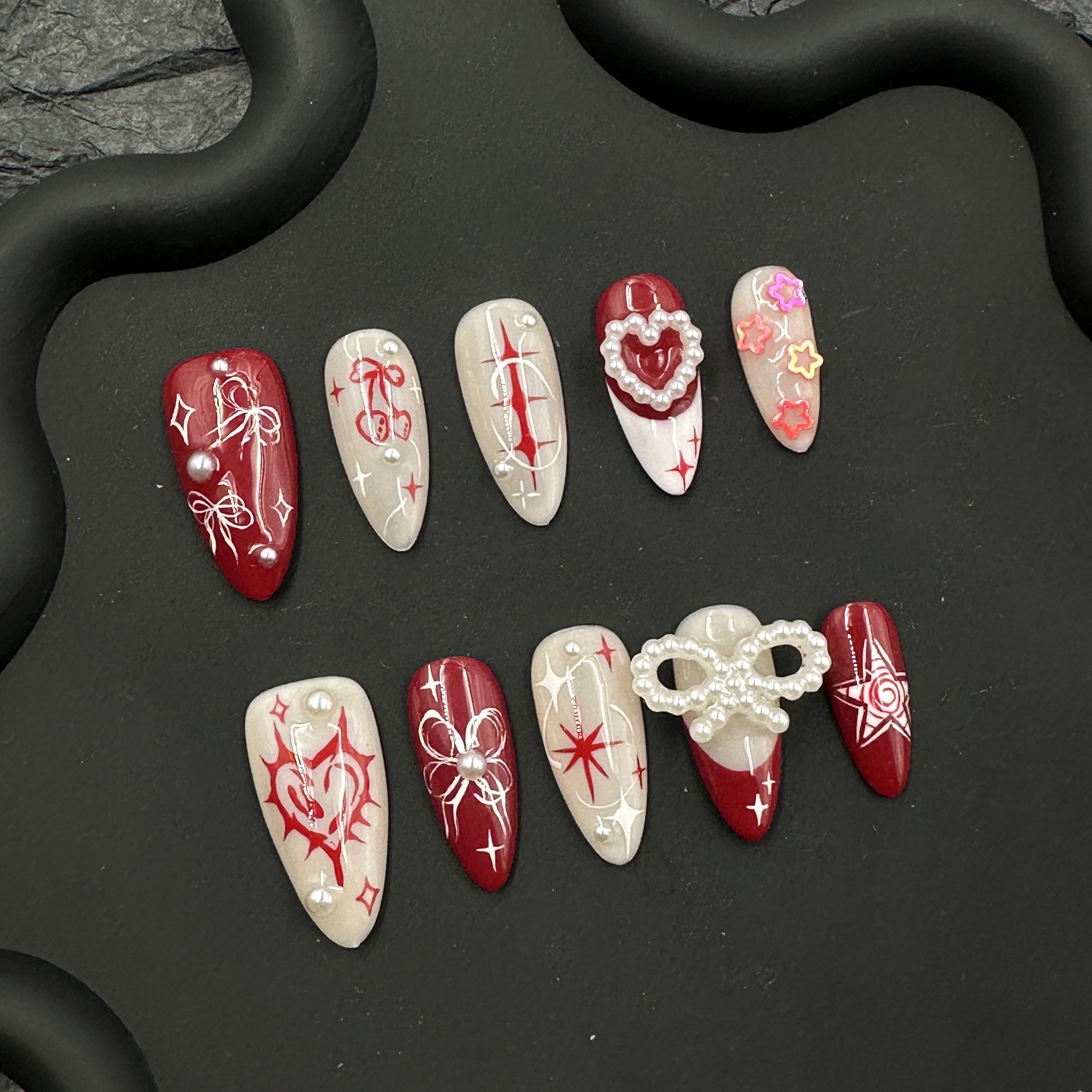 Red painted embossed nail art