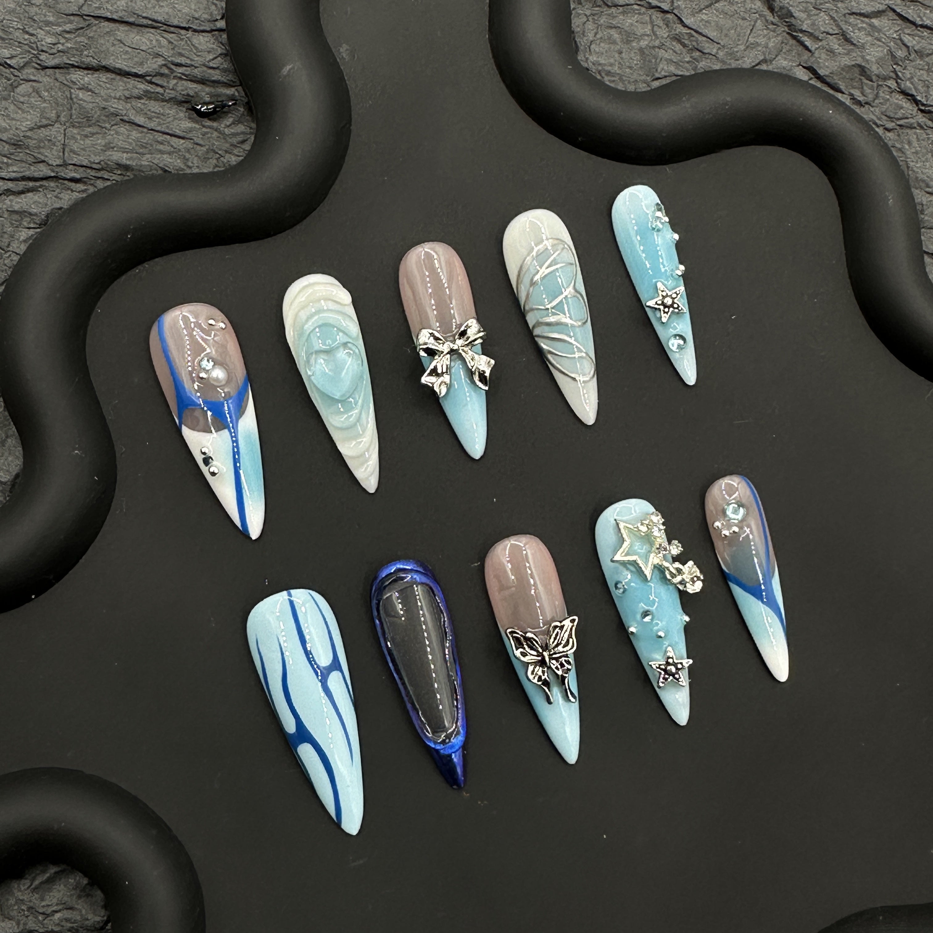 Blue hand painted embossed manicure