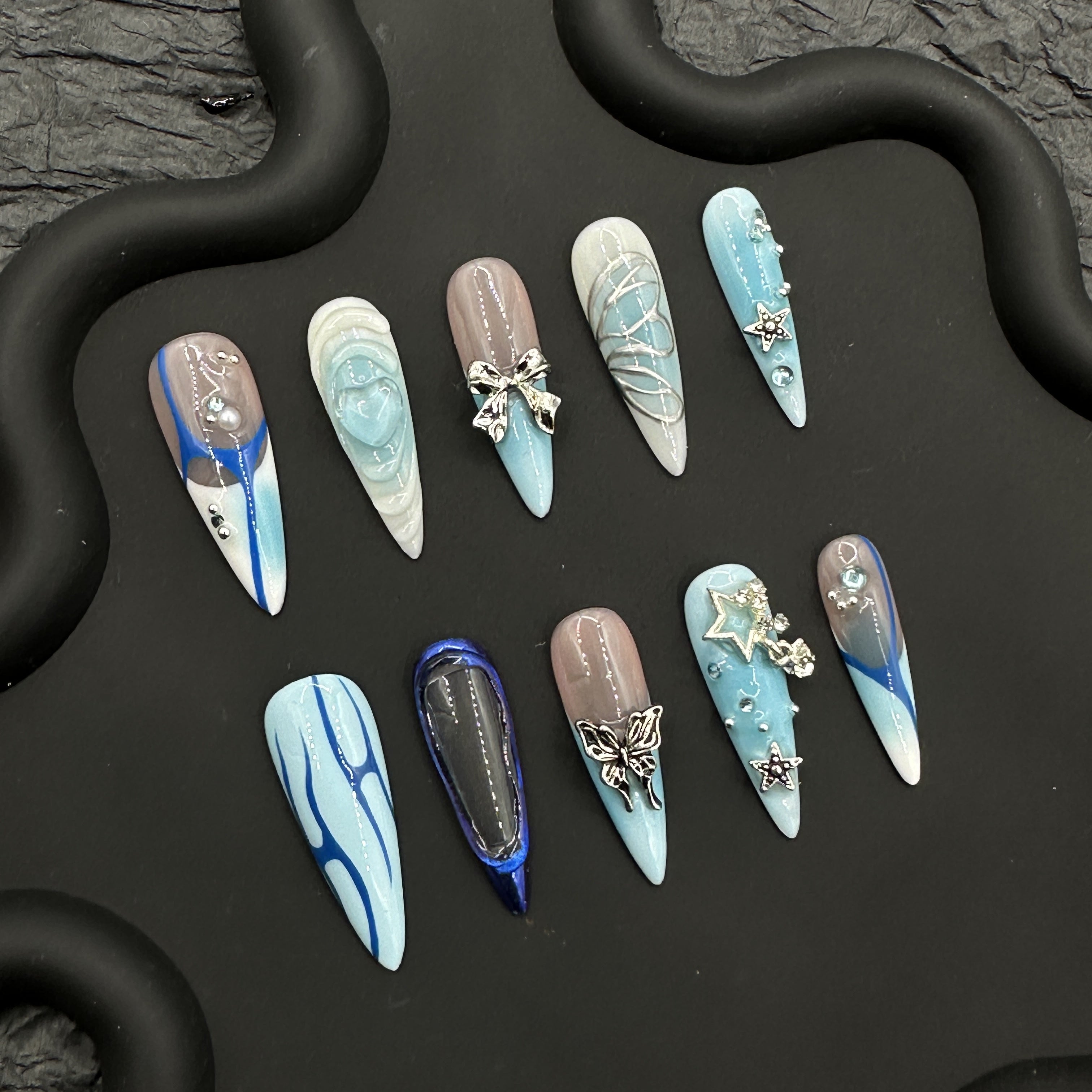 Blue hand painted embossed manicure