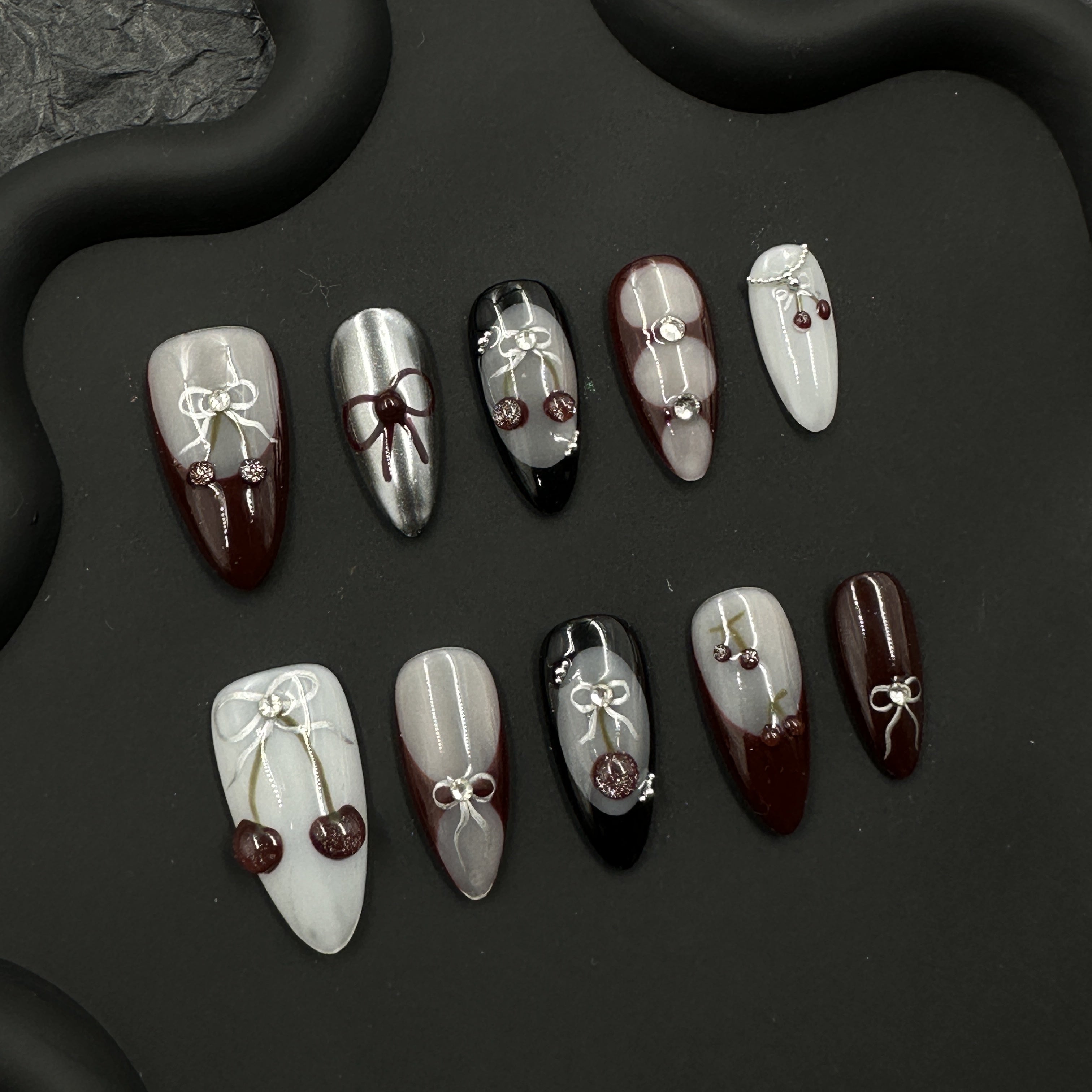 Brown cherry embossed manicure