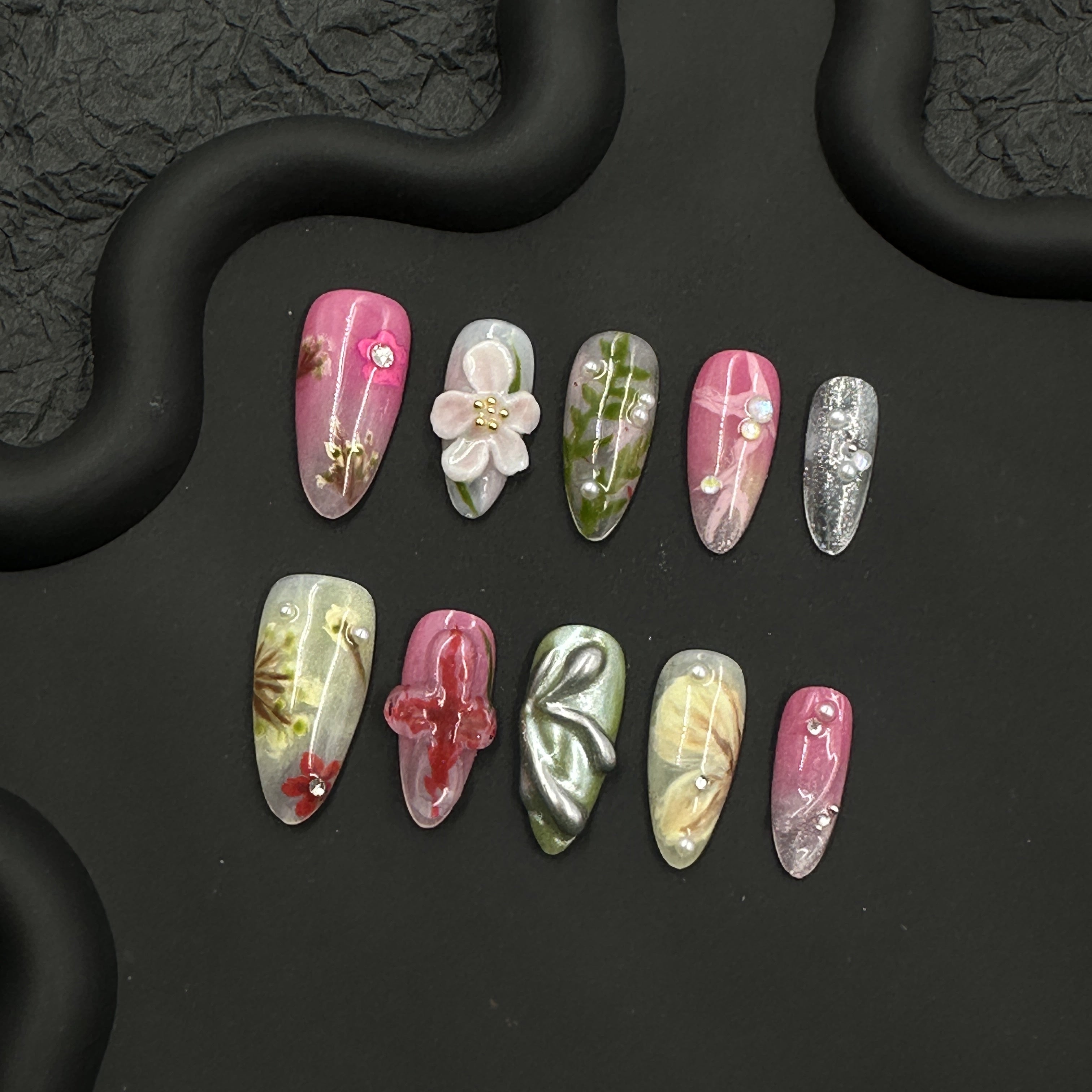 Painted embossed flower nail art