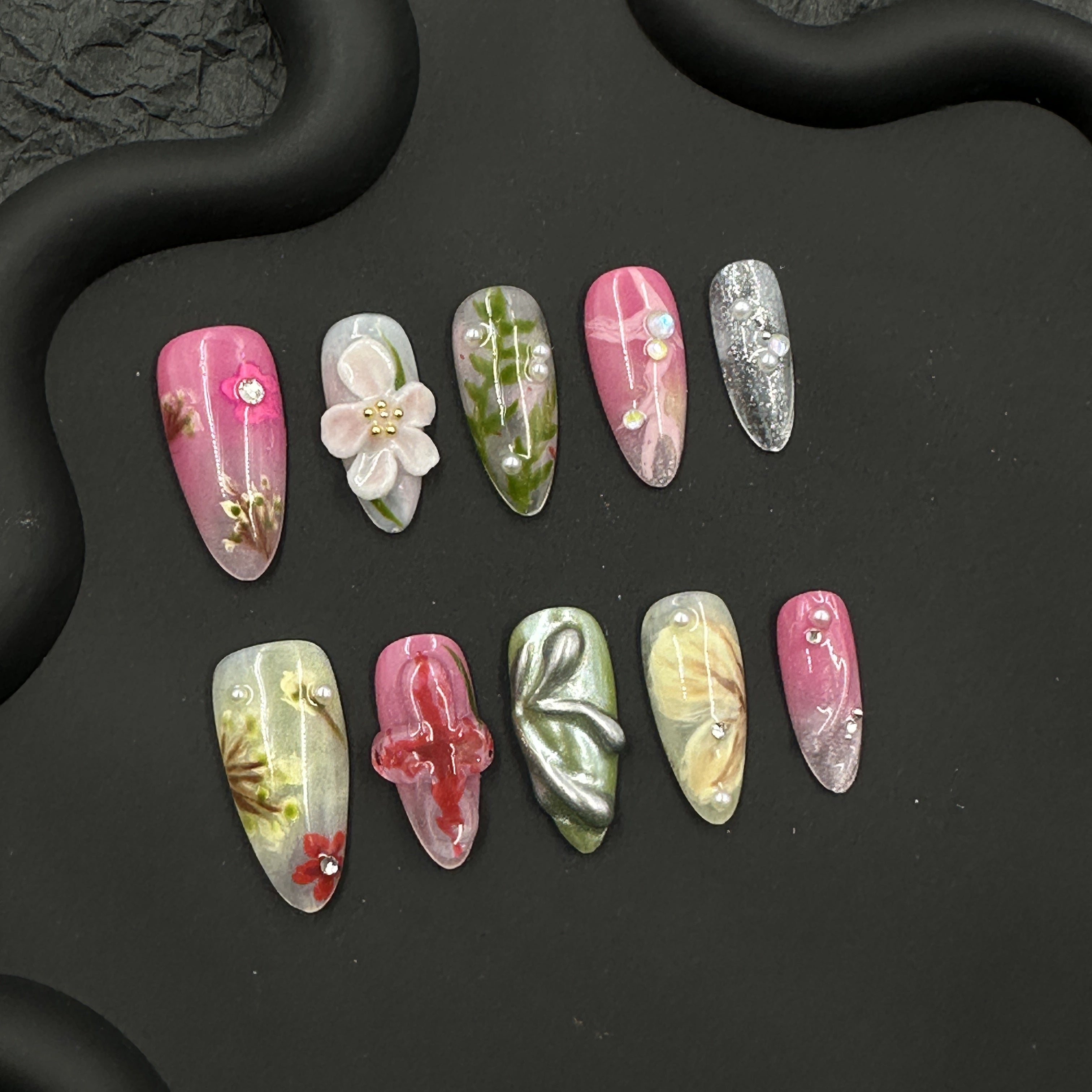 Painted embossed flower nail art